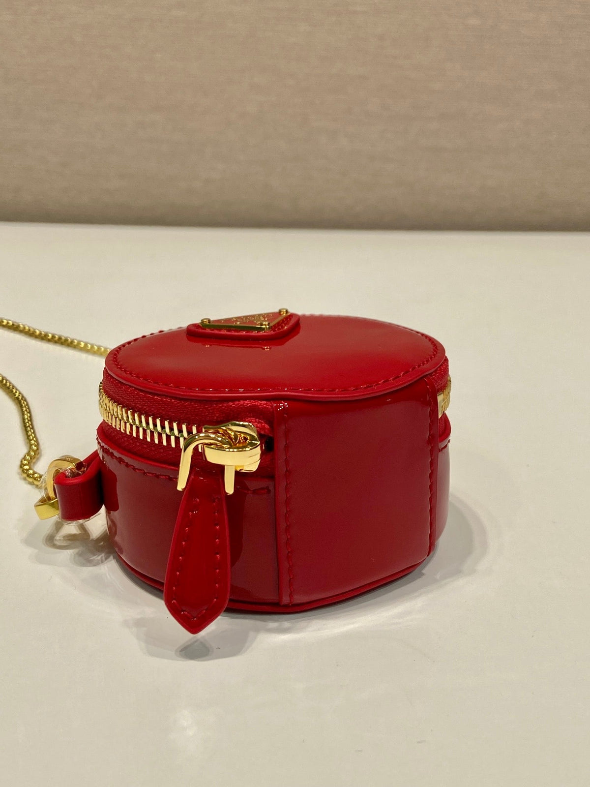 MINI ROUND BAG 8 IN RED GLOSSY CALFSKIN GOLD HARDWARE