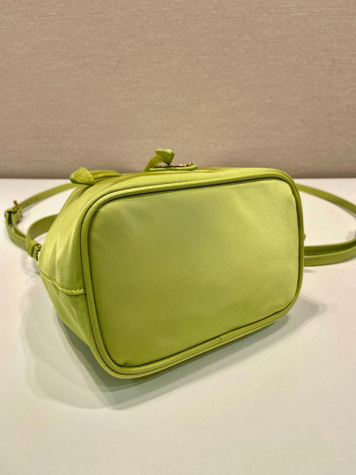 BUCKET BAG 19 IN APPLE GREEN RE-NYLON AND SAFFIANO LEATHER HANDLE