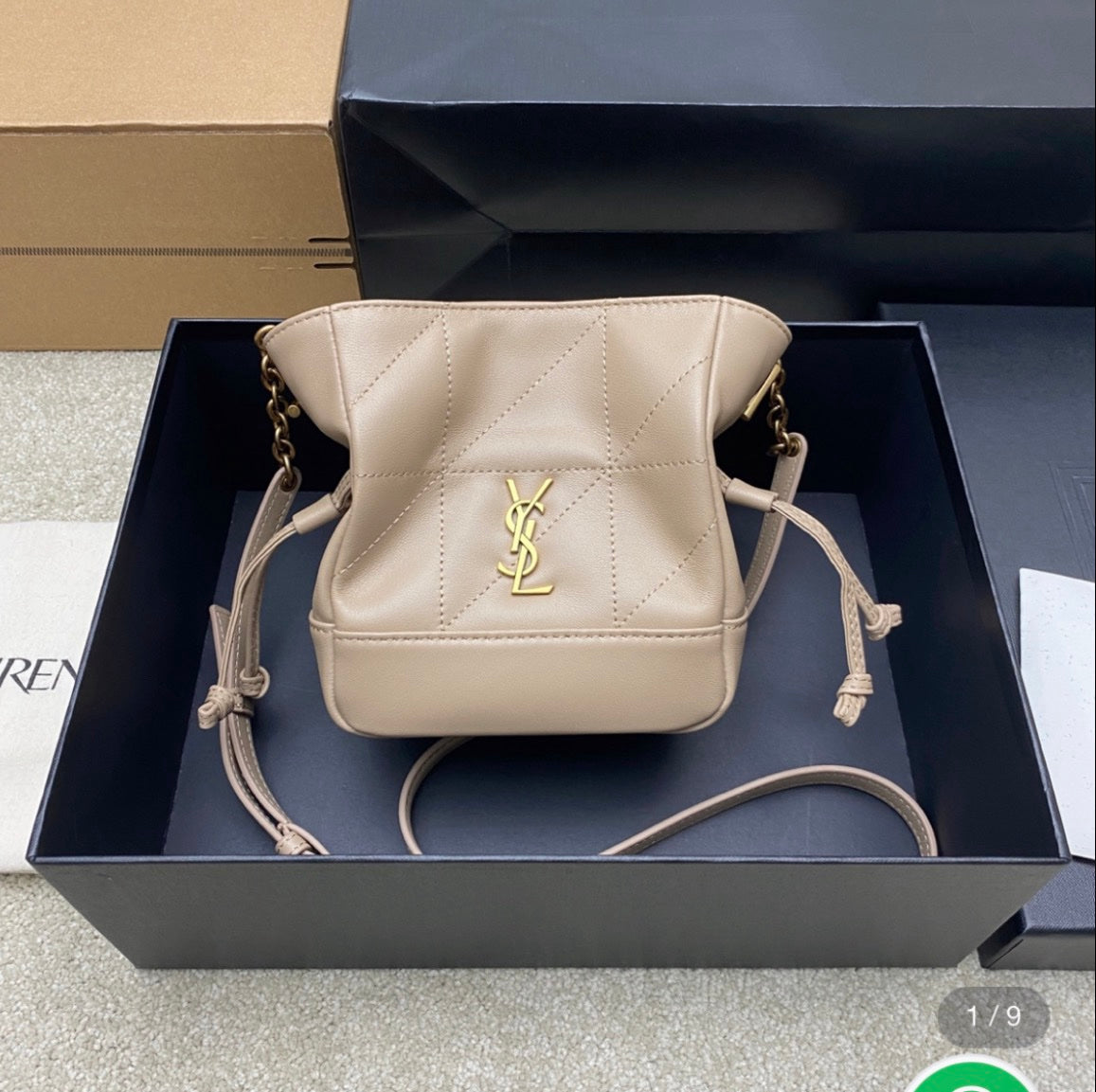 Saint Laurent Jamie mini shoulder pouch in beige lambskin leather.
