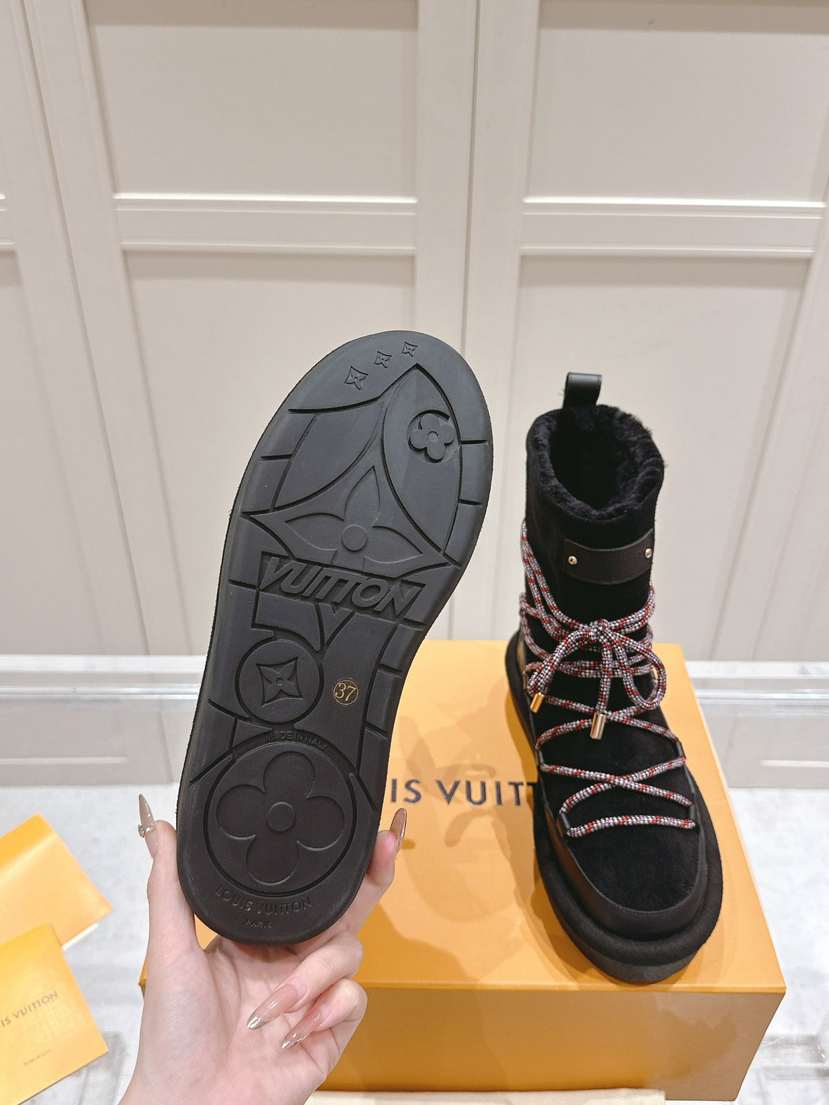 ASPEN PLATFORM ANKLE BOOT IN BLACK MONOGRAM DEBOSSED SUEDE AND SHEARLING