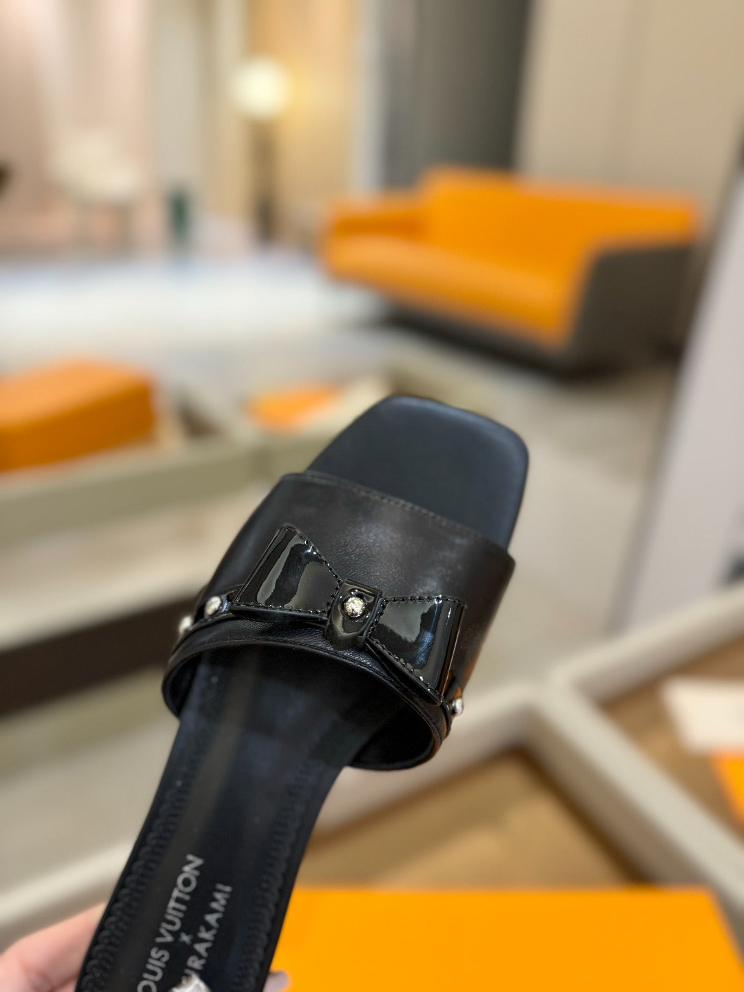 LV X TM 6AM FLAT MULE IN BLACK CALFSKIN