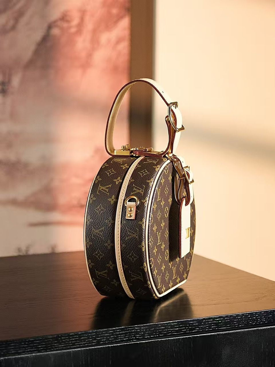 Louis Vuitton Petite Boite Chapeau handbag in Monogram canvas