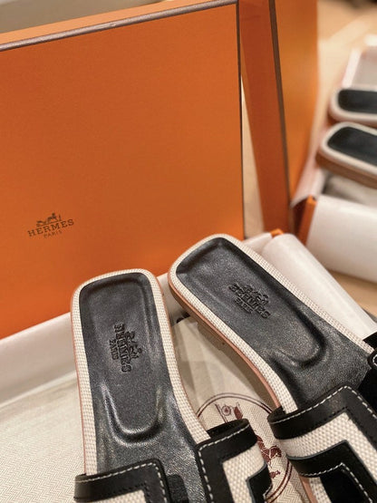 0RAN SANDALS IN BLACK CALFSKIN AND WHITE CANVAS