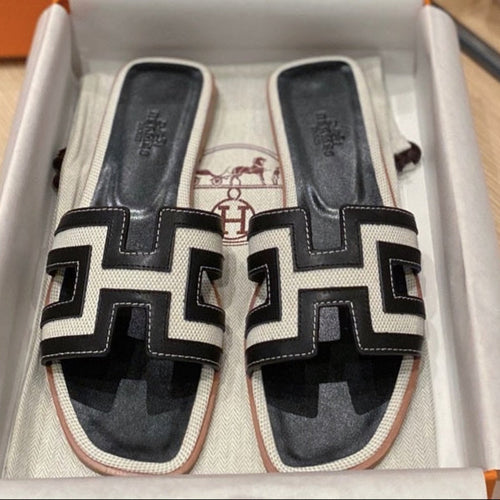 0RAN SANDALS IN BLACK CALFSKIN AND WHITE CANVAS