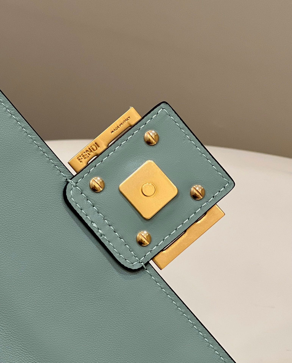 BAGUETTE WITH FF MOTIF 27 IN VIRIDIAN GREEN SOFT LAMBSKIN GOLD HARDWARE