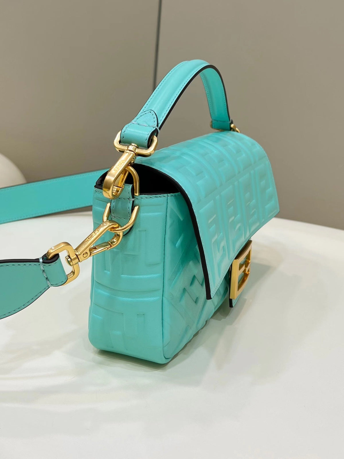 BAGUETTE WITH FF MOTIF 27 IN TURQUOISE SOFT LAMBSKIN GOLD HARDWARE