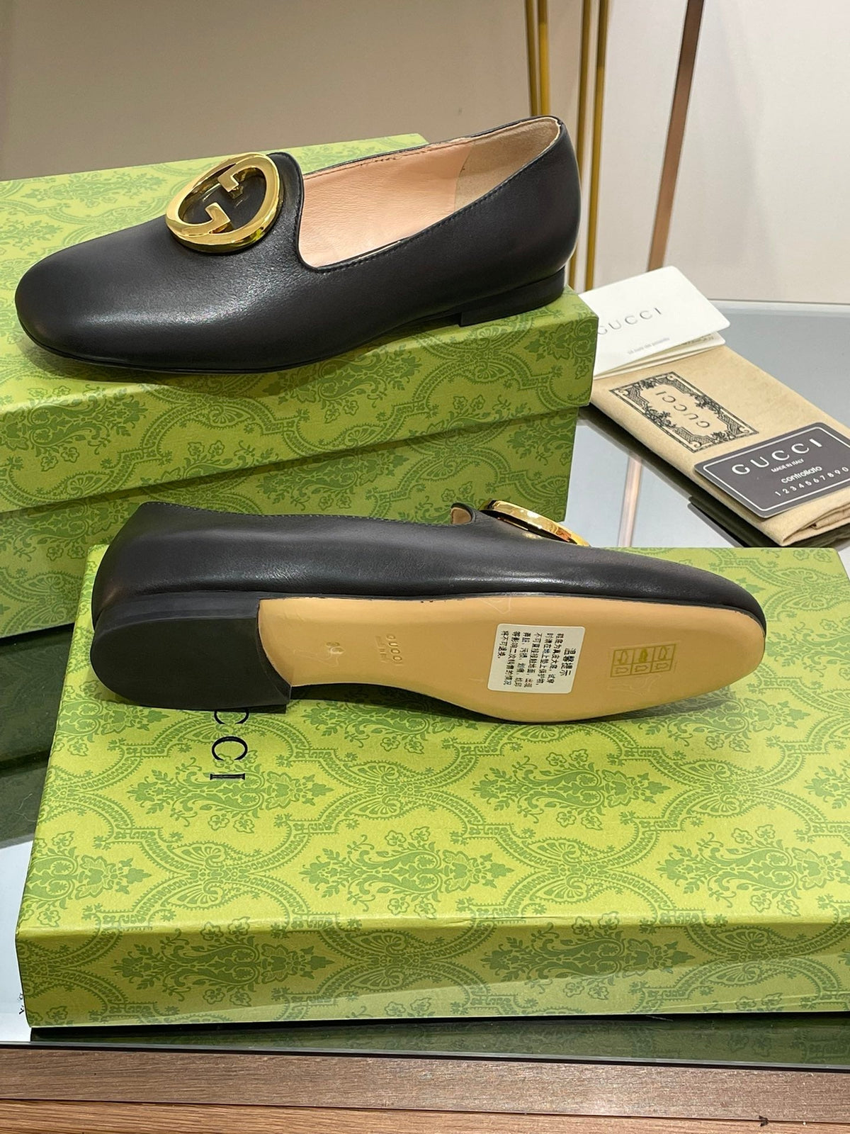 BLONDIE LOGO-PLAQUE LOAFERS IN BLACK CALFSKIN WITH GOLD HARDWARE
