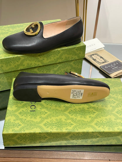 BLONDIE LOGO-PLAQUE LOAFERS IN BLACK CALFSKIN WITH GOLD HARDWARE