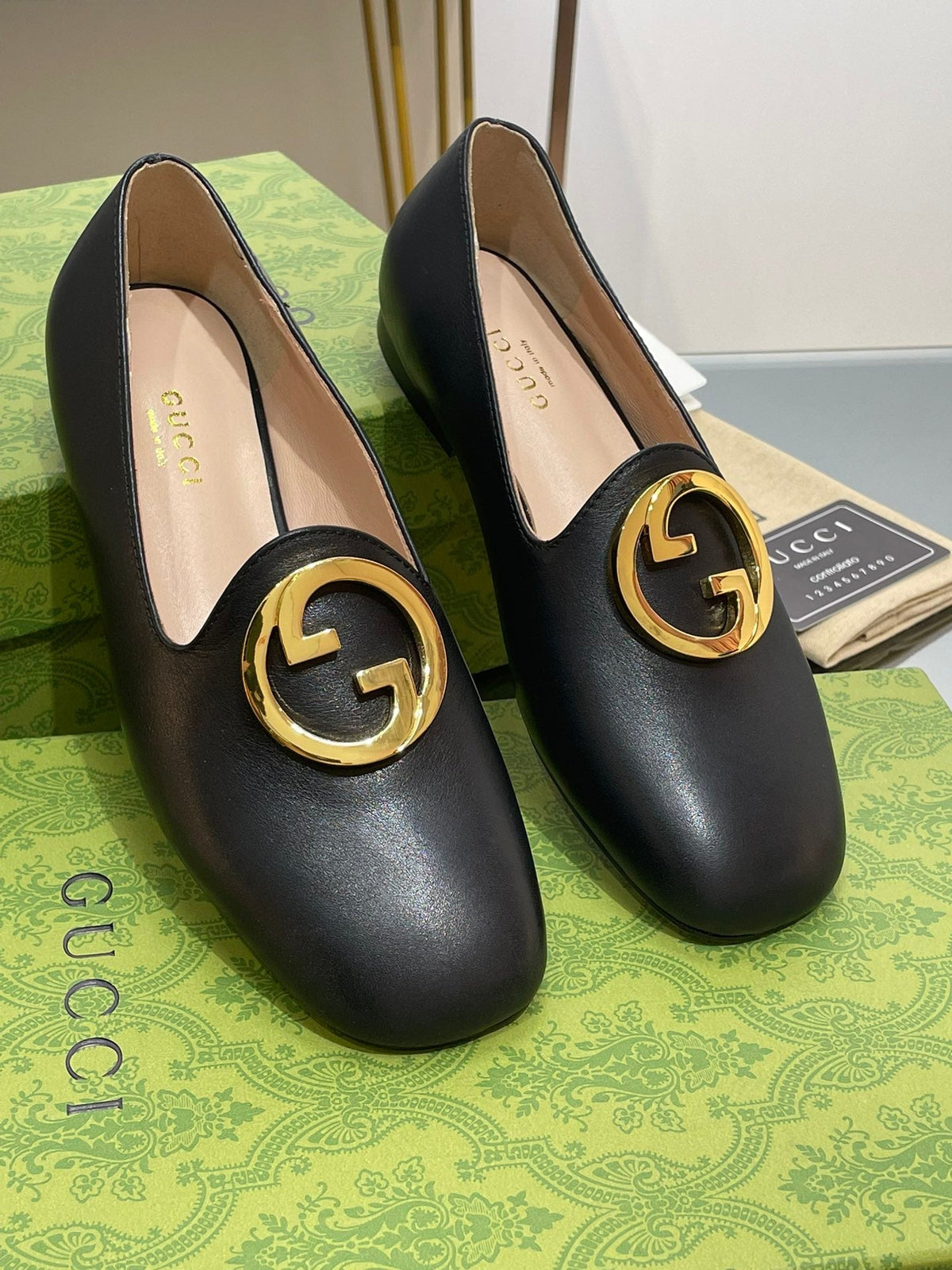 BLONDIE LOGO-PLAQUE LOAFERS IN BLACK CALFSKIN WITH GOLD HARDWARE
