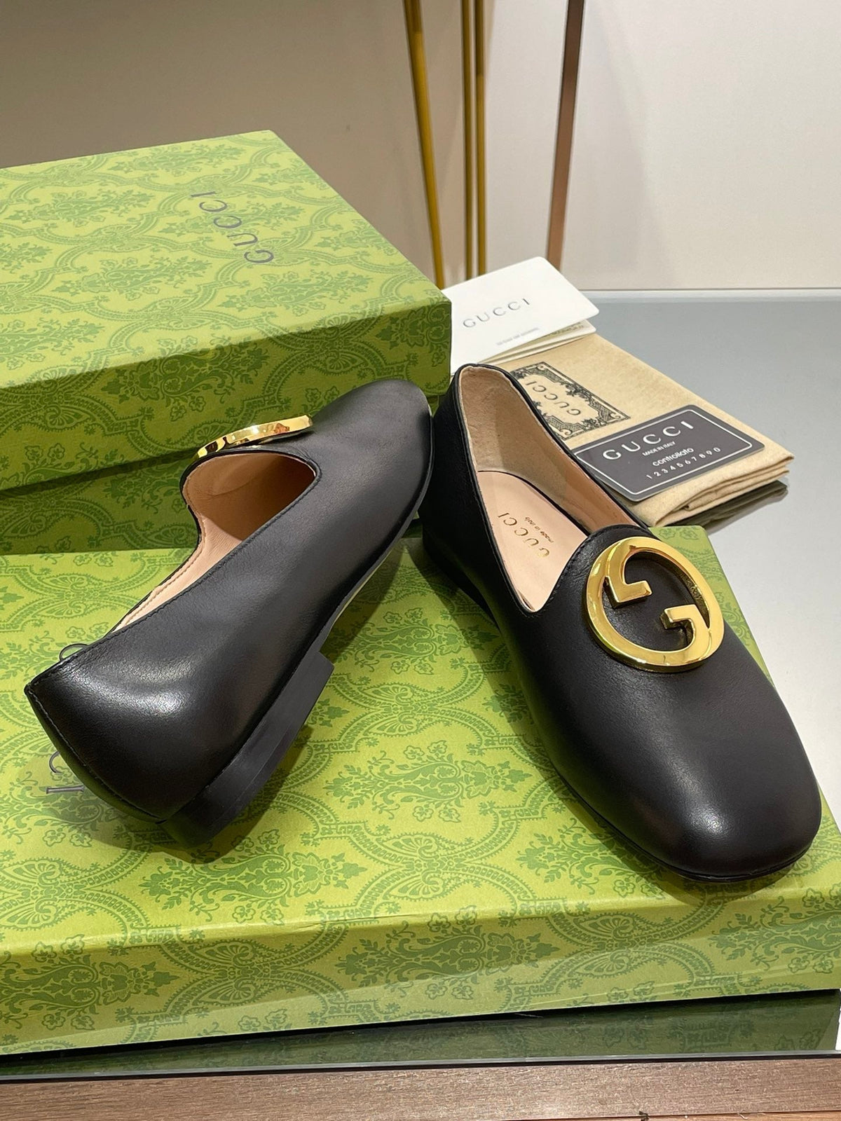BLONDIE LOGO-PLAQUE LOAFERS IN BLACK CALFSKIN WITH GOLD HARDWARE