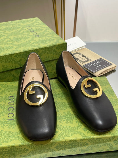 BLONDIE LOGO-PLAQUE LOAFERS IN BLACK CALFSKIN WITH GOLD HARDWARE