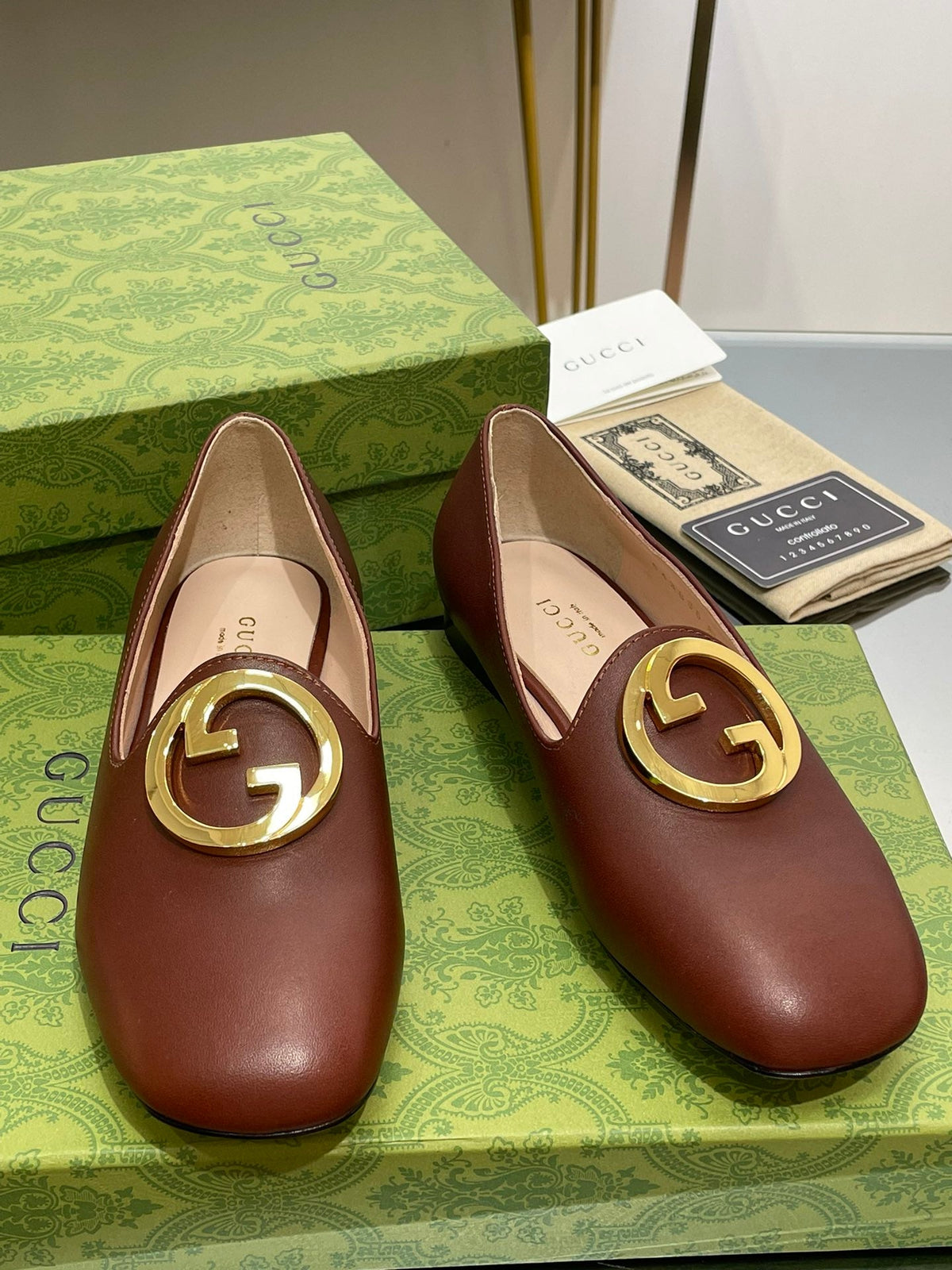 BLONDIE LOGO-PLAQUE LOAFERS IN SYRUP BROWN CALFSKIN WITH GOLD HARDWARE