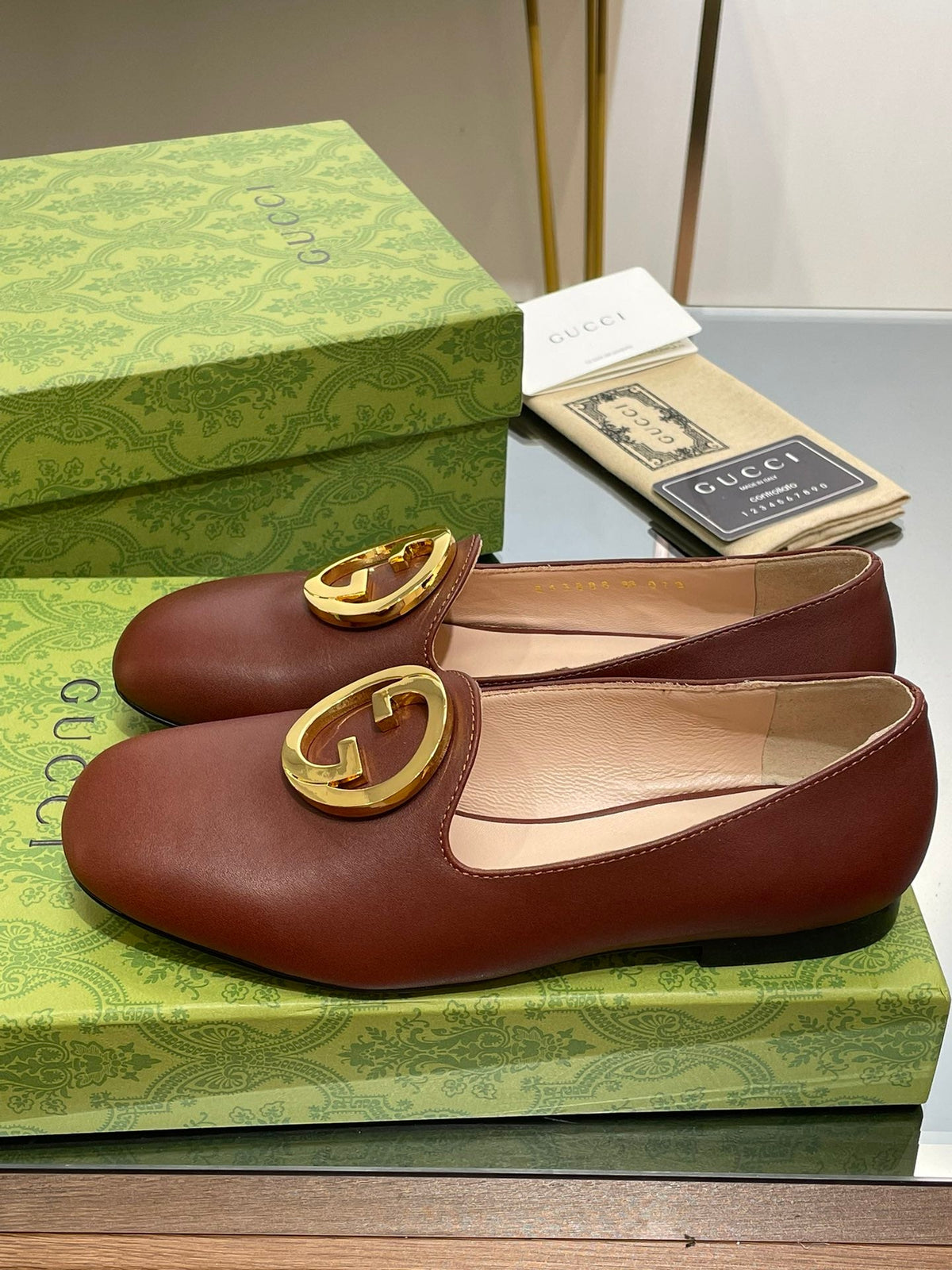 BLONDIE LOGO-PLAQUE LOAFERS IN SYRUP BROWN CALFSKIN WITH GOLD HARDWARE