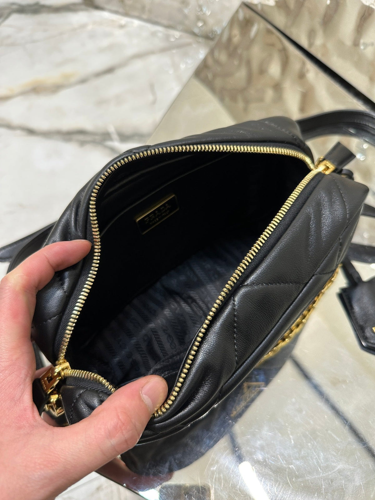 CAMERA BAG 22 IN BLACK TRIANGLE PATTERN QUILTED LAMBSKIN GOLD HARDWARE