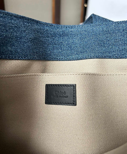 MEDIUM WOODY TOTE BAG 37 IN BLUE DENIM BLACK CALFSKIN