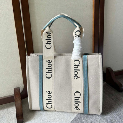 LAGRE WOODY TOTE BAG 45 IN BEIGE LINEN CANVAS BLACK WEBBING LOGO EMBROIDER BLUE CALFSKIN