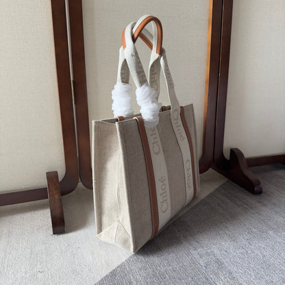 MEDIUM WOODY TOTE BAG 37 IN BEIGE LINEN CANVAS WEBBING LOGO EMBROIDERY BROWN CALFSKIN