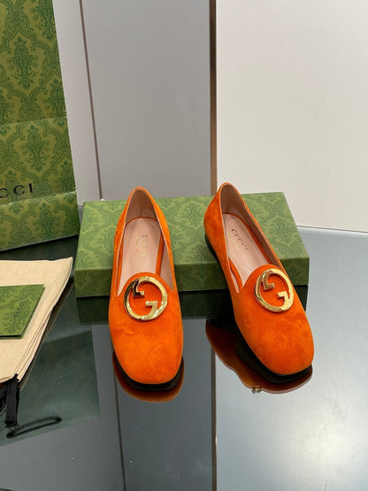 BLONDIE LOGO-PLAQUE LOAFERS IN TIGER ORANGE SUEDE WITH GOLD HARDWARE