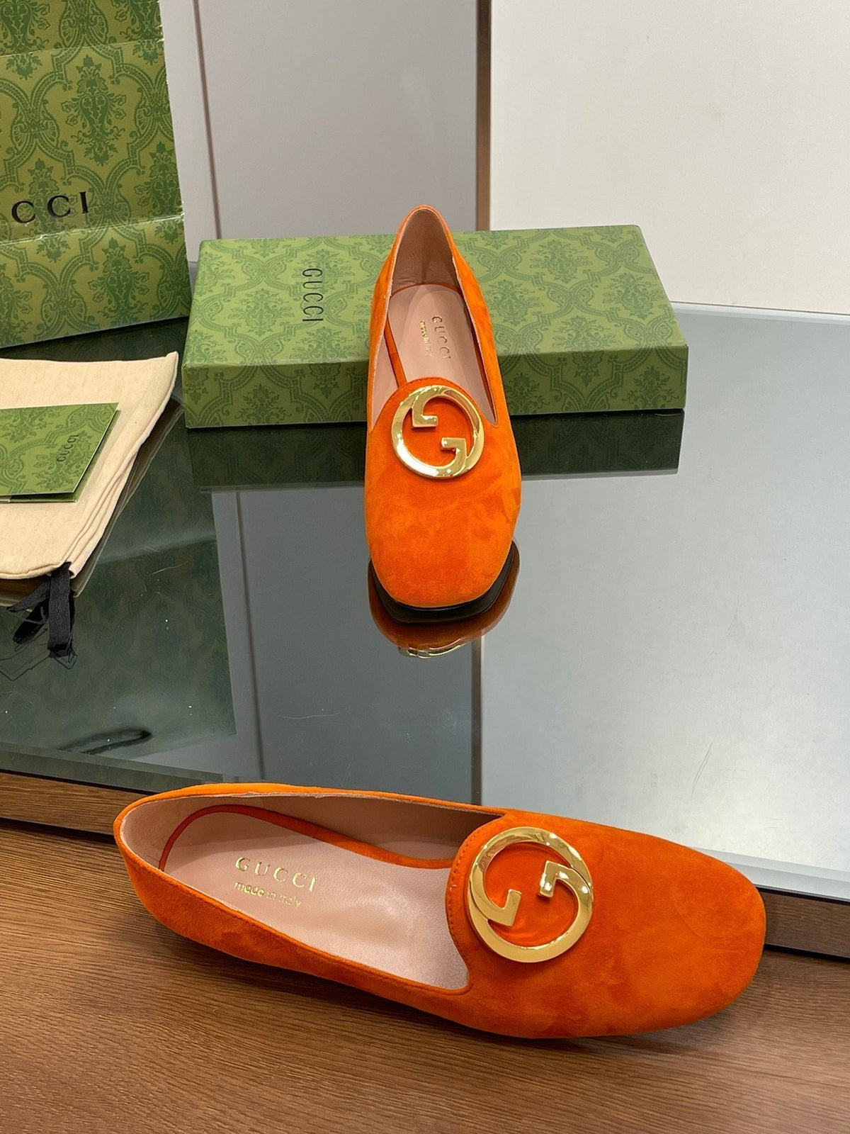BLONDIE LOGO-PLAQUE LOAFERS IN TIGER ORANGE SUEDE WITH GOLD HARDWARE