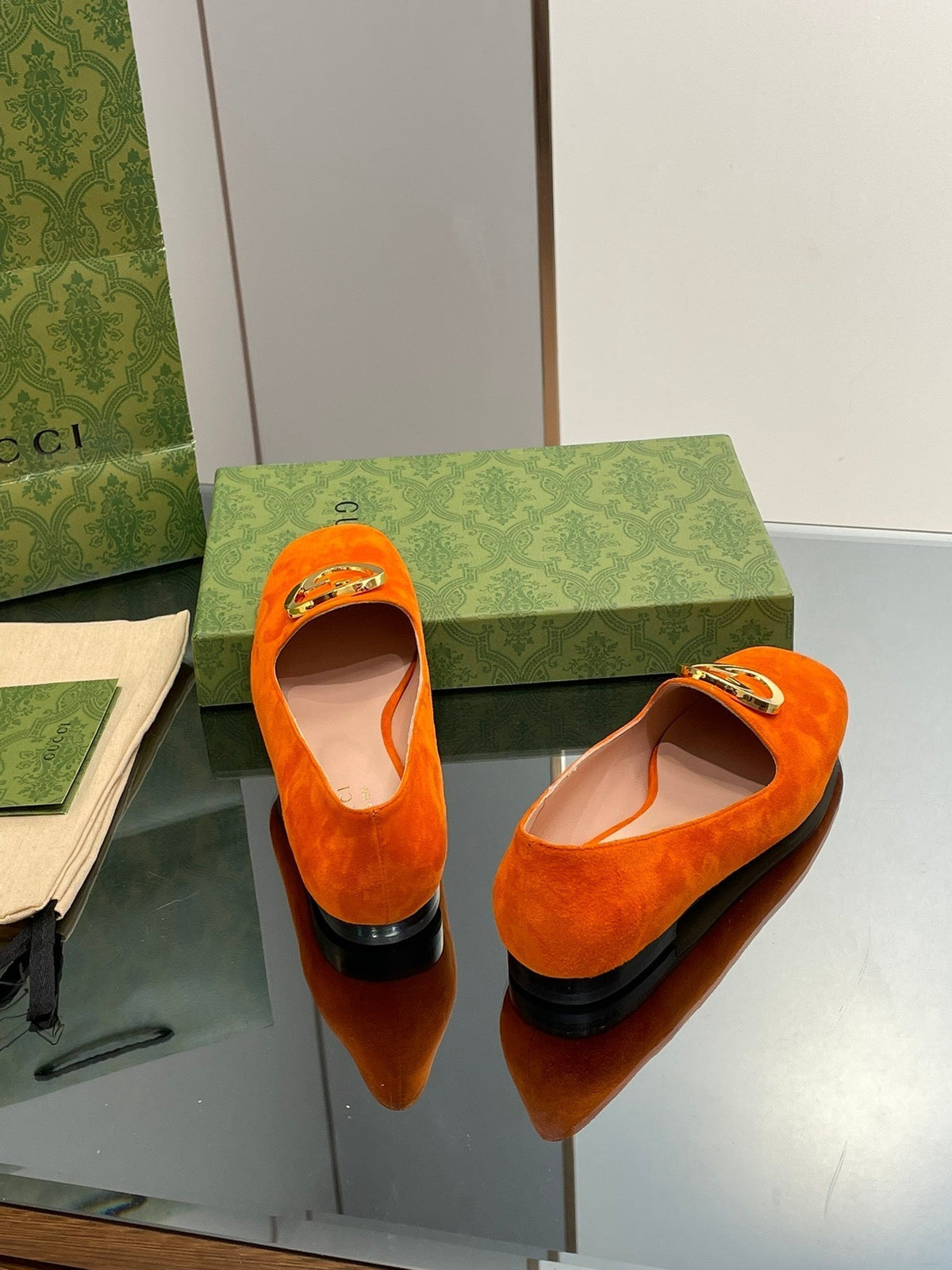 BLONDIE LOGO-PLAQUE LOAFERS IN TIGER ORANGE SUEDE WITH GOLD HARDWARE