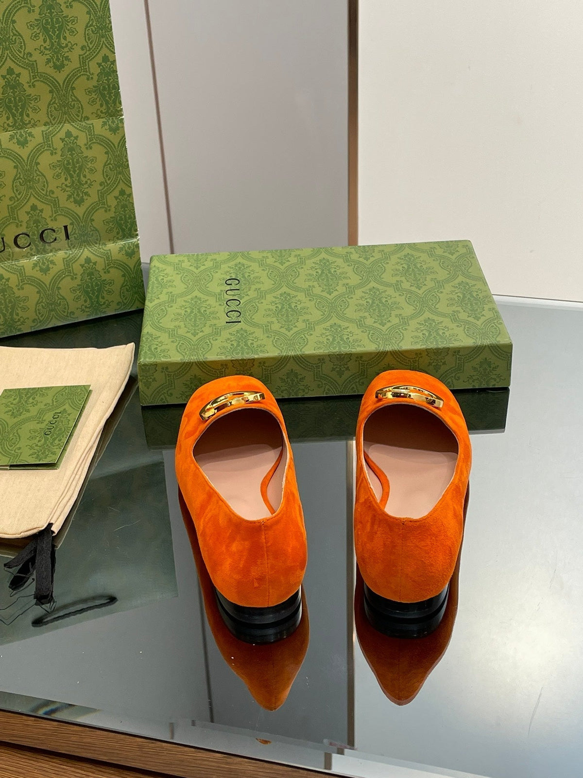 BLONDIE LOGO-PLAQUE LOAFERS IN TIGER ORANGE SUEDE WITH GOLD HARDWARE
