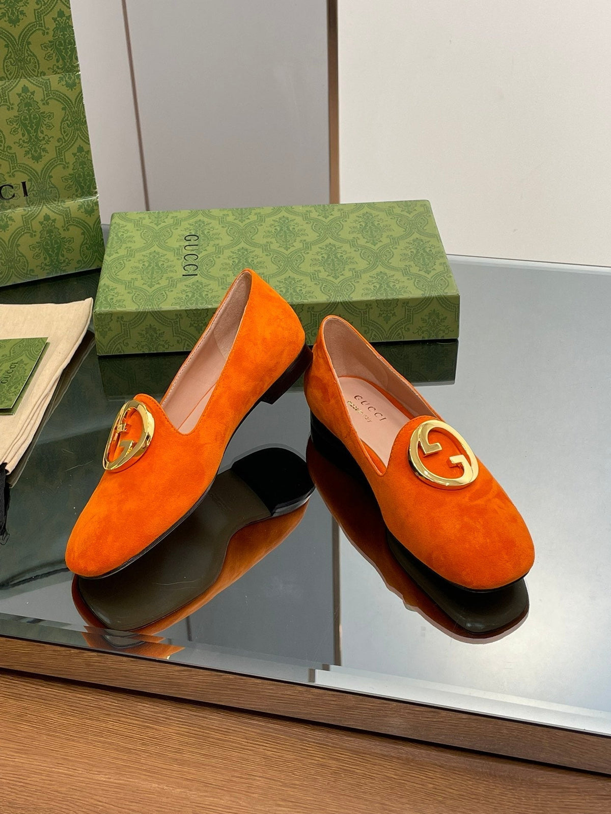 BLONDIE LOGO-PLAQUE LOAFERS IN TIGER ORANGE SUEDE WITH GOLD HARDWARE