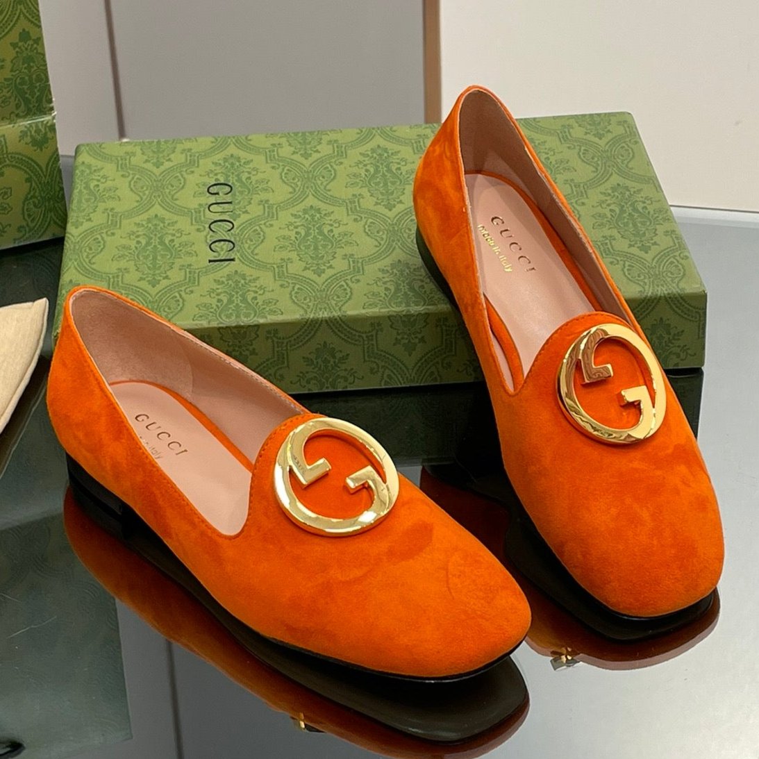 BLONDIE LOGO-PLAQUE LOAFERS IN TIGER ORANGE SUEDE WITH GOLD HARDWARE
