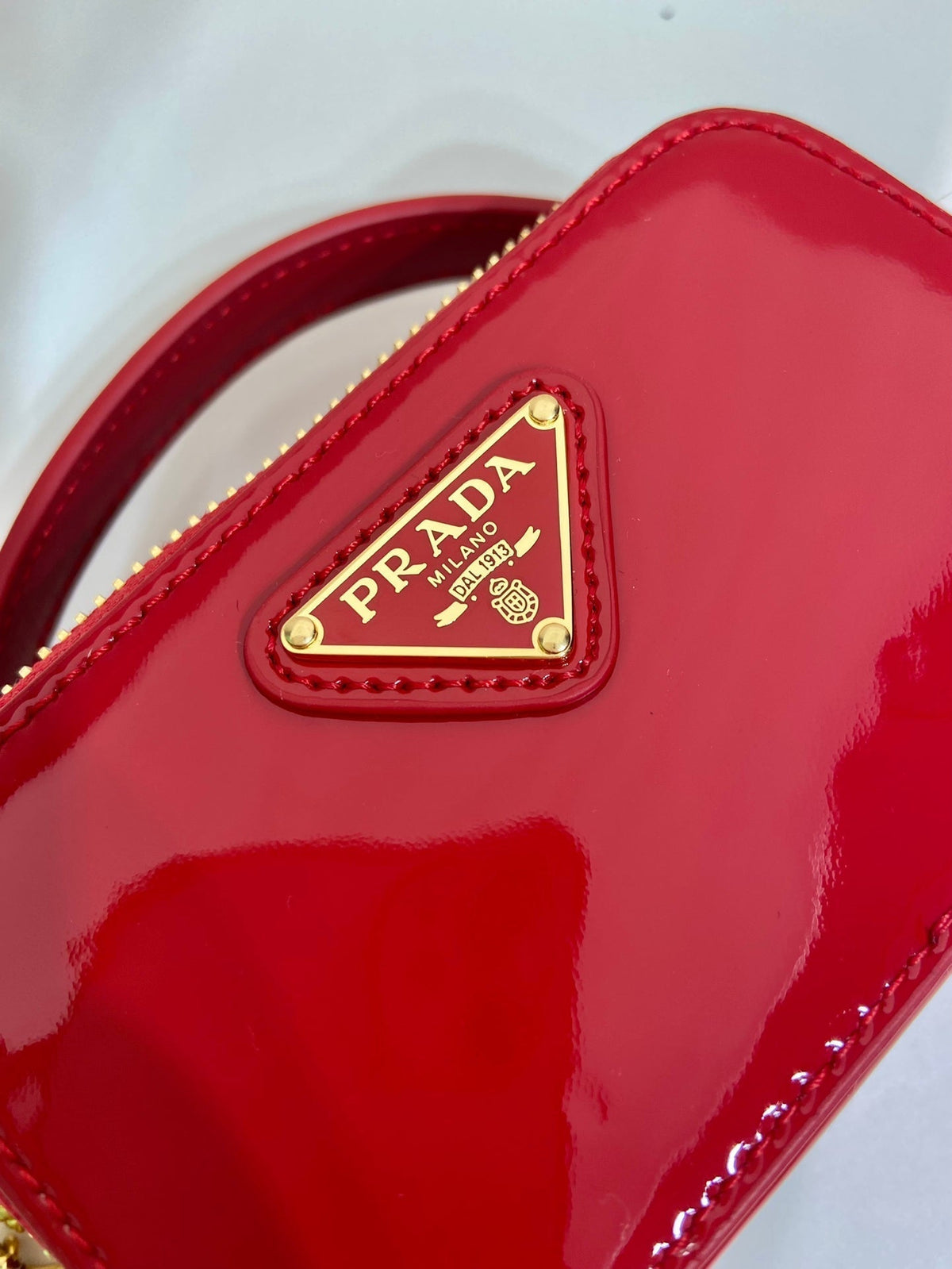 MINI HAND BAG 11 WITH GOLD STRAP IN RED PATENT CALFSKIN