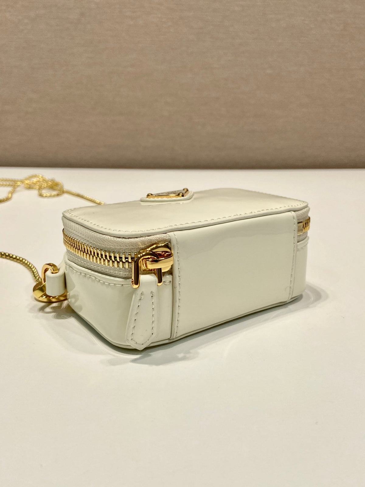 MINI HAND BAG 11 WITH GOLD STRAP IN WHITE PATENT CALFSKIN