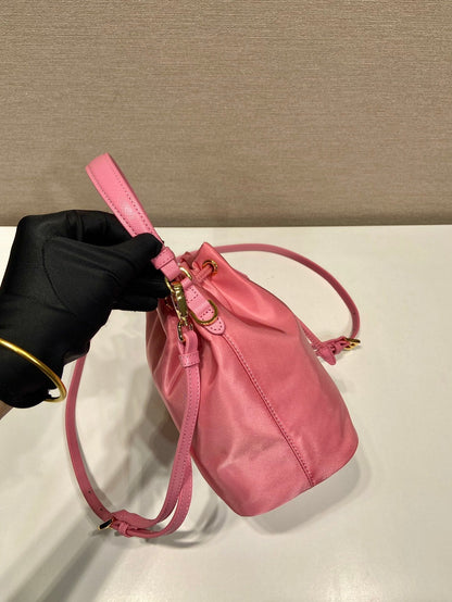 BUCKET BAG 19 IN CANDY PINK RE-NYLON AND SAFFIANO LEATHER HANDLE