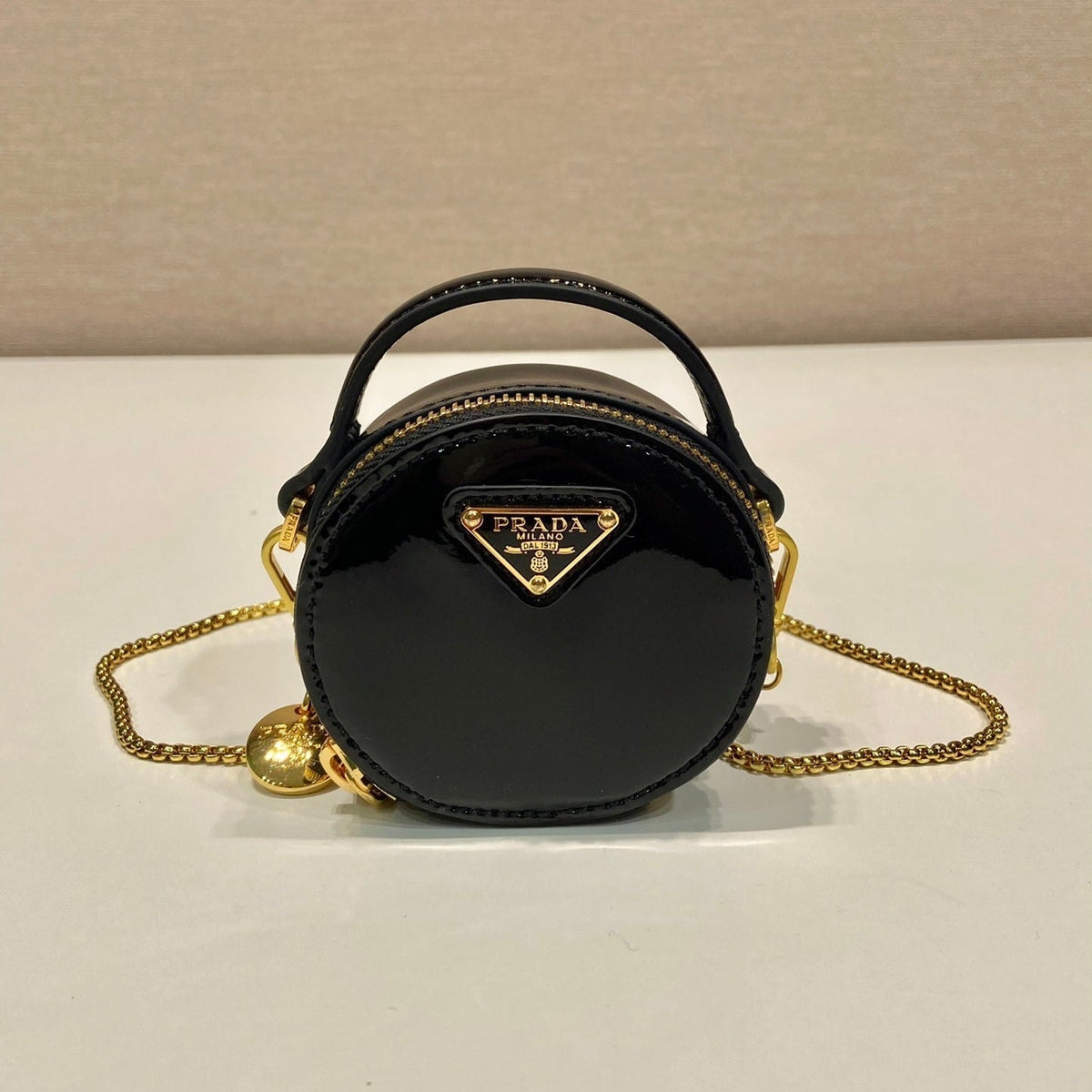 MINI ROUND BAG 8 IN BLACK GLOSSY CALFSKIN GOLD HARDWARE