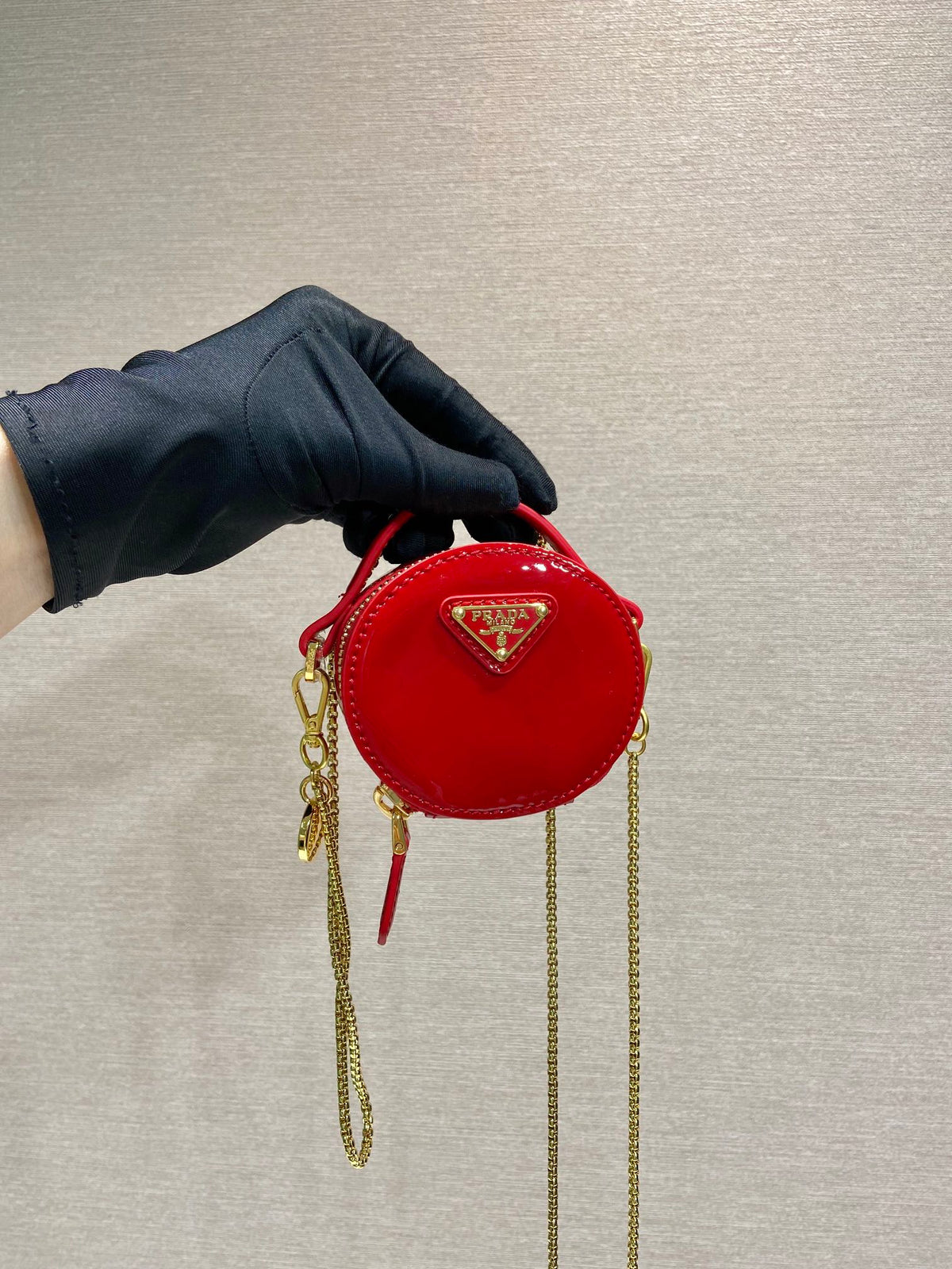 MINI ROUND BAG 8 IN RED GLOSSY CALFSKIN GOLD HARDWARE