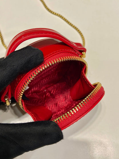 MINI ROUND BAG 8 IN RED GLOSSY CALFSKIN GOLD HARDWARE