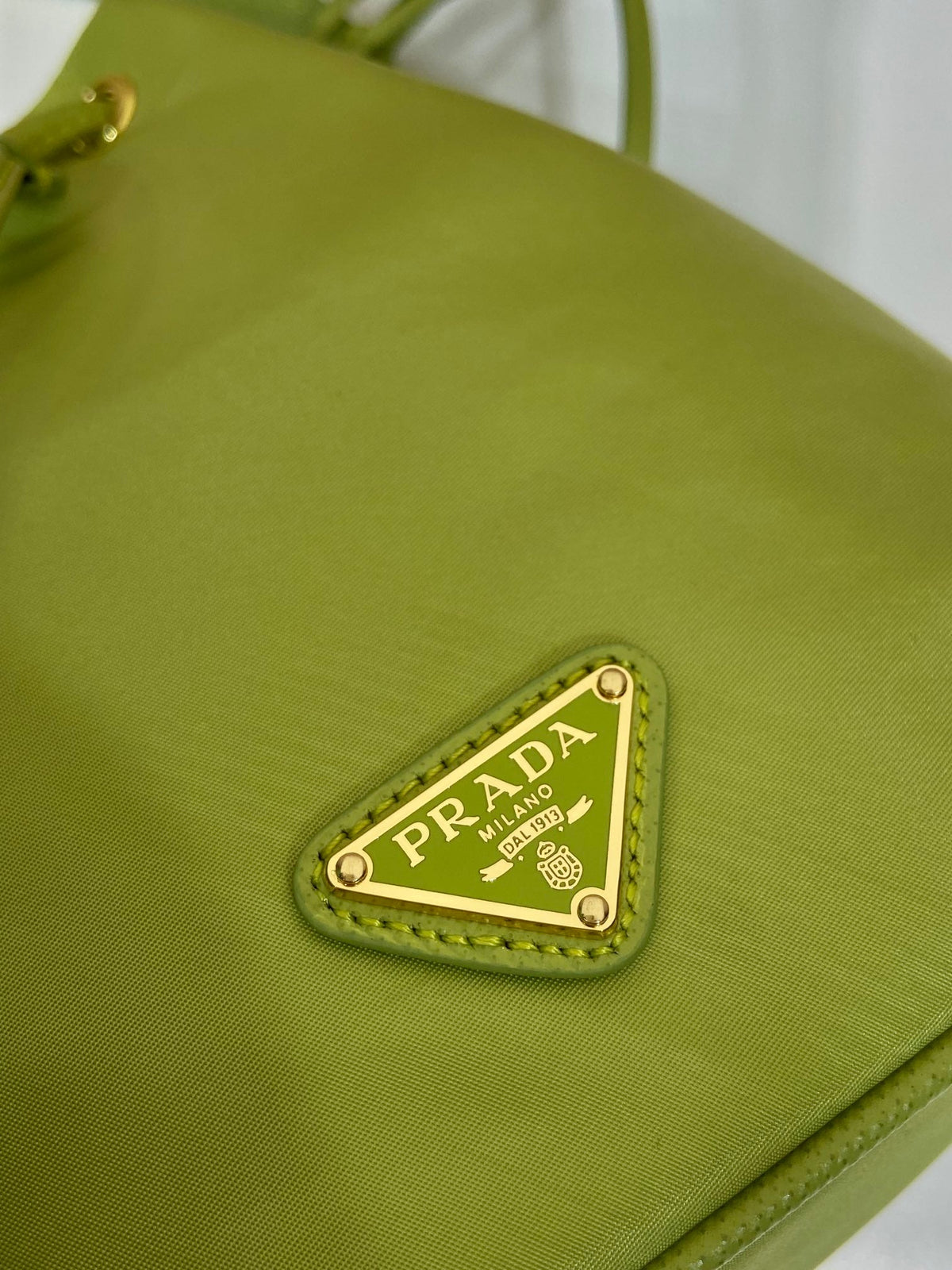 BUCKET BAG 19 IN APPLE GREEN RE-NYLON AND SAFFIANO LEATHER HANDLE