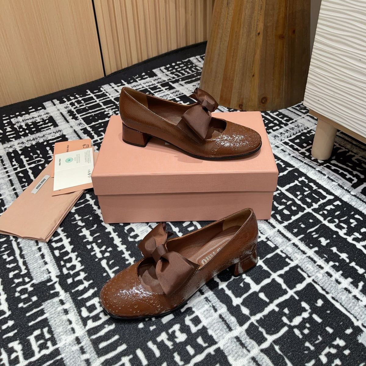 MARY JANE MID HEEL PUMPS IN RUSSET BROWN PATENT LAMBSKIN WITH BOW
