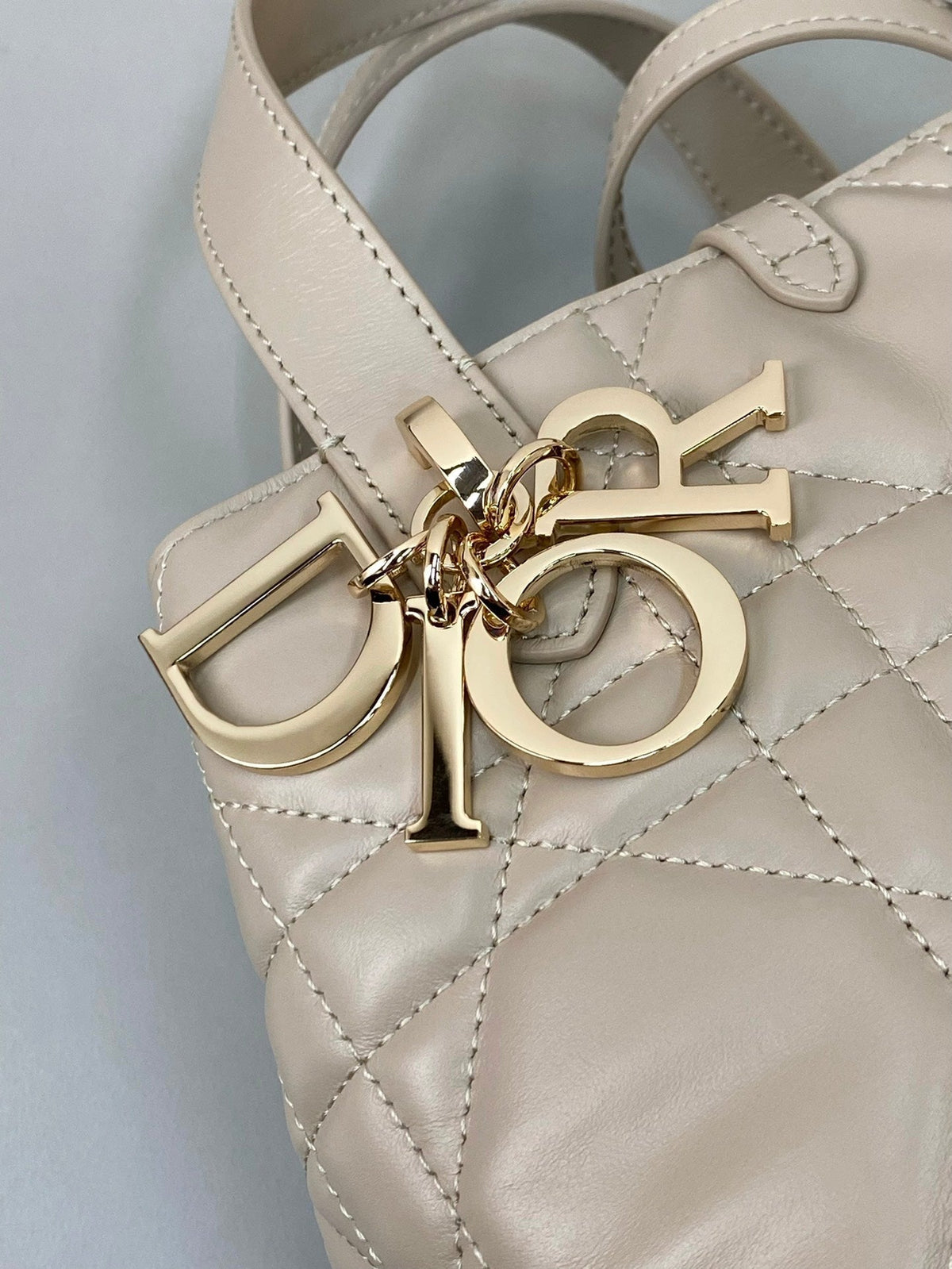 MINI TOUJOURS BUCKET BAG 18 IN BEIGE CANNAGE CALFSKIN