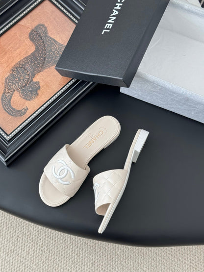 Chanel Women Cream Quilted Leather Slides