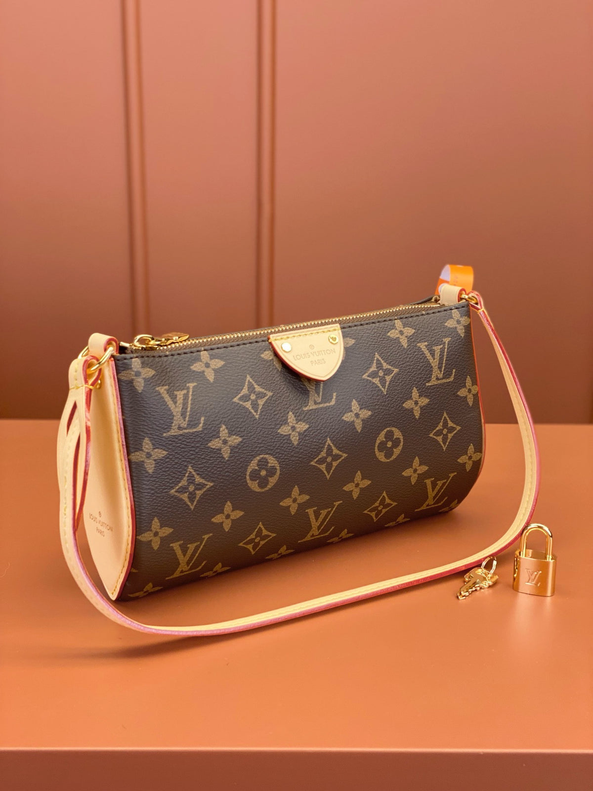Louis Vuitton Pochette Tirette bag in monogram coated canvas