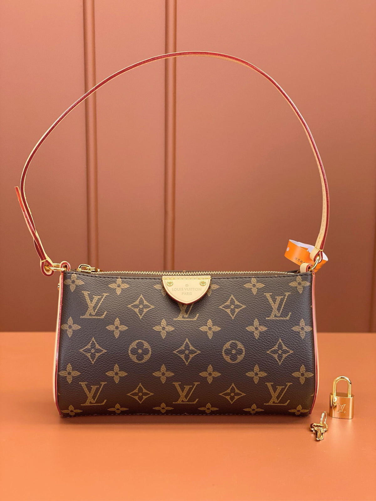 Louis Vuitton Pochette Tirette bag in monogram coated canvas