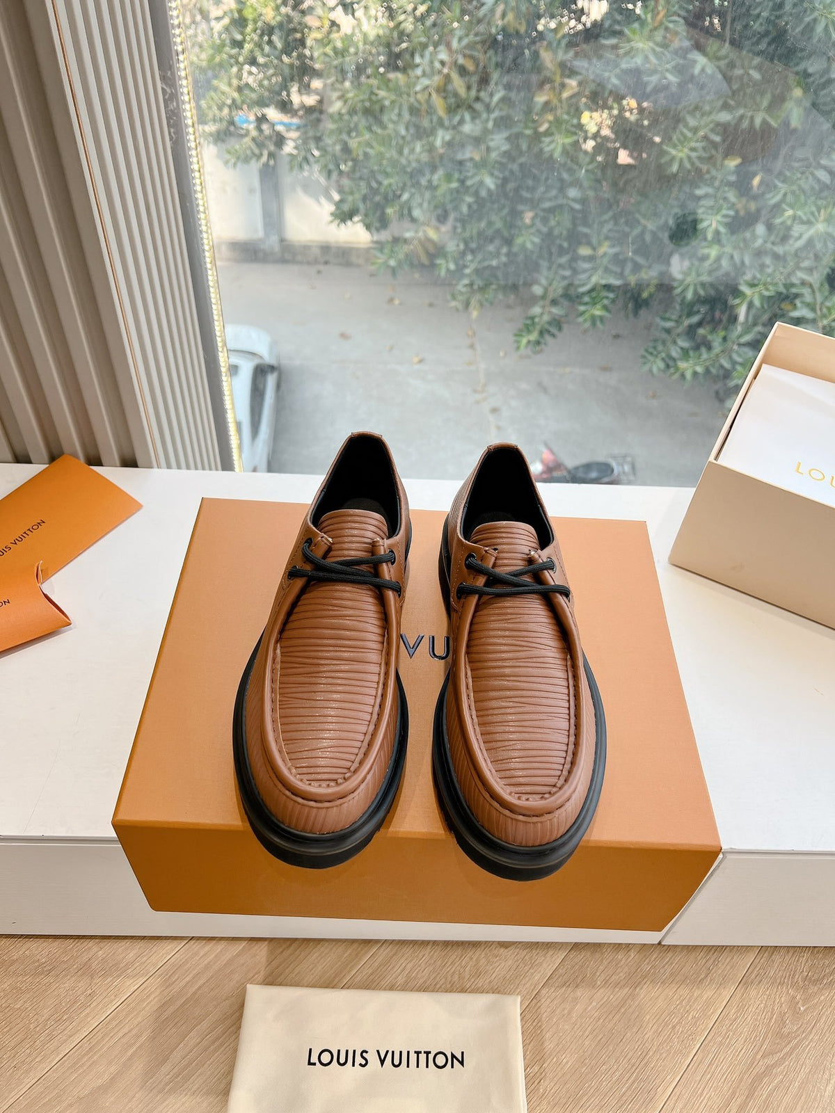 LV Women Brown Textured Leather Loafers