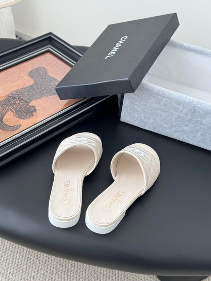 Chanel Women Cream Quilted Leather Slides