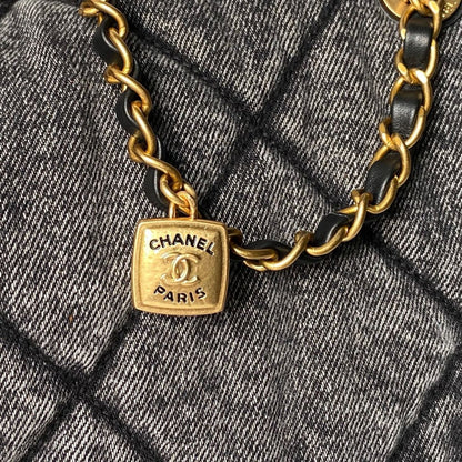 Chanel Maxi Flapbag in washed denim with gold-tone metal hardware