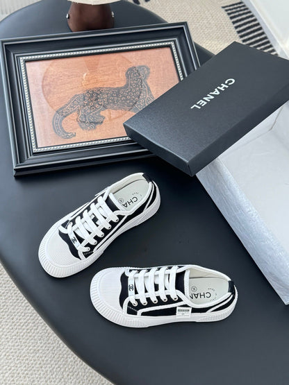 Chanel Women Black Canvas White Trim Sneakers