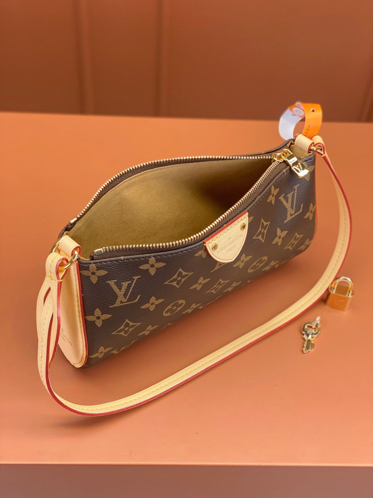 Louis Vuitton Pochette Tirette bag in monogram coated canvas