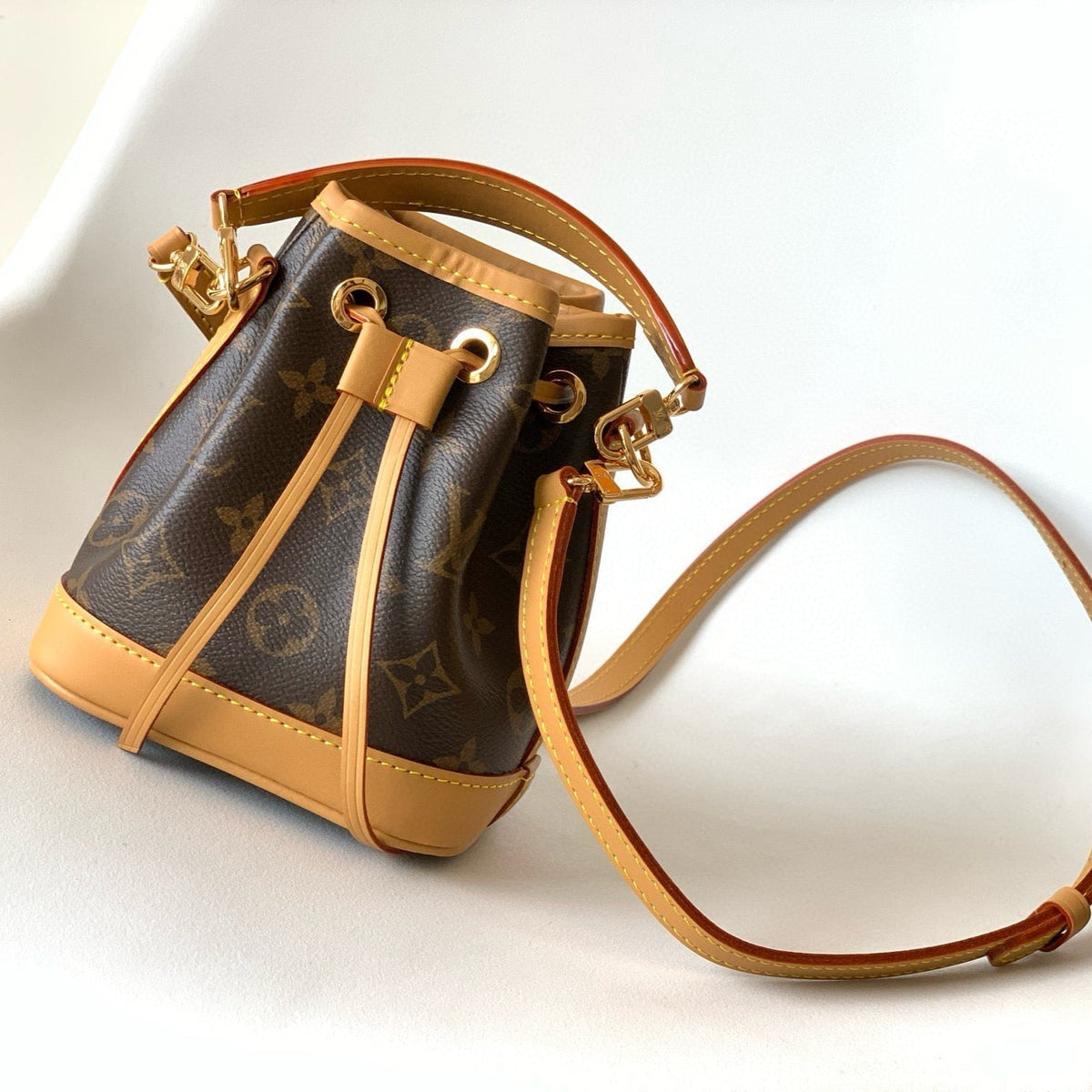 NANO NOÉ 16 IN BROWN MONOGRAM CALFSKIN