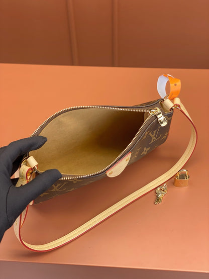 Louis Vuitton Pochette Tirette bag in monogram coated canvas