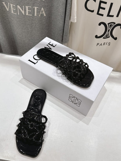 Loewe Leather Petal Anagram Slides in Black