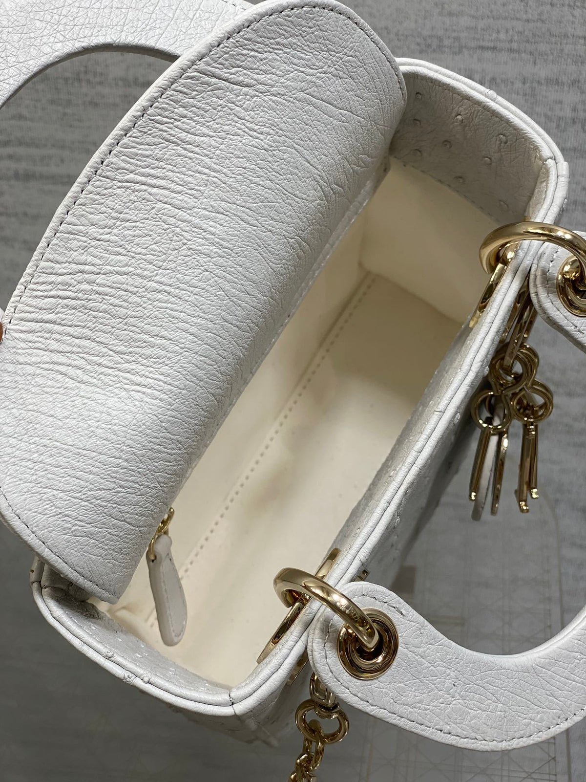 Christian Dior Mini Lady Dior bag in white ostrich leather