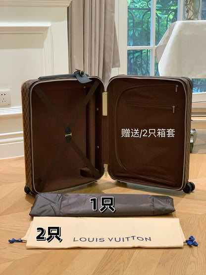 Louis Vuitton Horizon 55 rolling suitcase in Damier Ebene canvas.