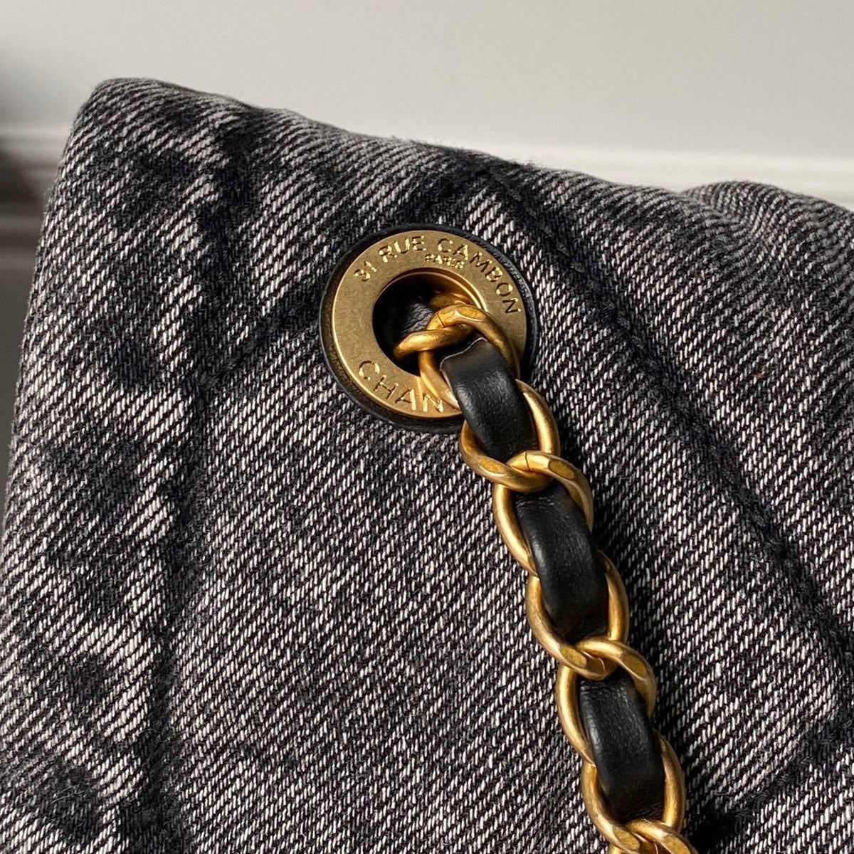 Chanel Maxi Flapbag in washed denim with gold-tone metal hardware